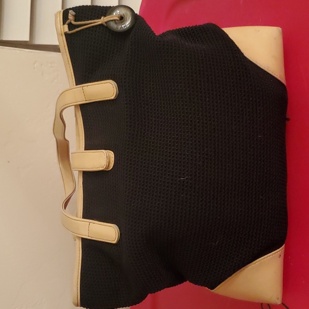 The Sak 90’s Style Knot Chord Bag with Leather Accents.